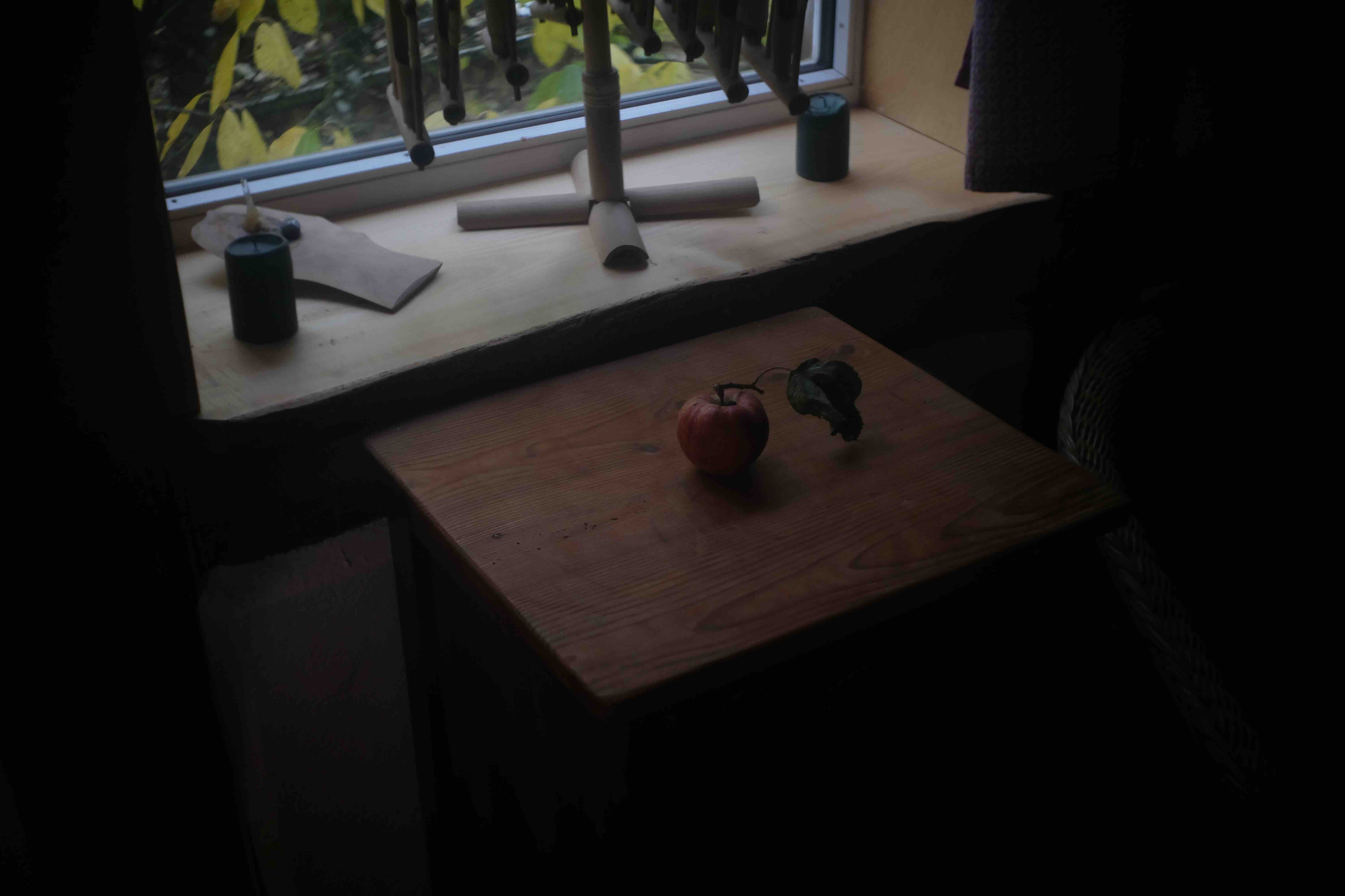 an apple on a pedastal